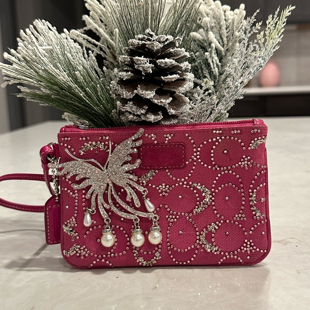 Coach Crystal Pink Wristlet Butterfly Accent and Crystal design by. Crystal
